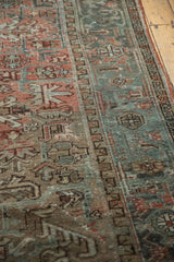 Distressed vintage Mehrivan carpet pile with geometric floral motifs in terra cotta and slate blue.