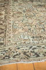 Distressed geometric patterns in muted blue, beige, and charcoal brown on a vintage Mehrivan runner.