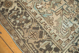 Distressed geometric pattern with textured pile in sandy beige, powder blue, and dark brown.