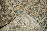 Hand-knotted foundation and distressed geometric pattern of a vintage Mehrivan runner corner.