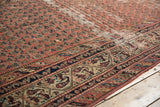 Distressed texture of Malayer runner with madder red Mir Boteh and ornate navy border.