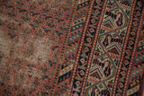Geometric border in navy, ivory, and red, with a distressed madder Mir Boteh field.