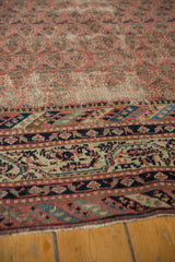 Close-up of vintage distressed Malayer rug runner's worn texture and Mir Boteh motif.