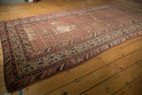 Distressed vintage Malayer runner, madder red field, showing extensive wear and Mir Boteh motifs.