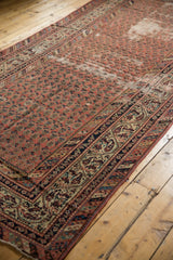 Distressed madder red Malayer runner with allover Mir Boteh pattern and navy border.