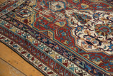 Hand-knotted antique Shirvan carpet, geometric patterns in wine red, sky blue, ivory; wear exposing foundation.