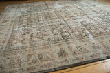 Distressed vintage Mahal carpet's etched texture, faded Herati motif, beige, and blush.