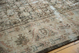 Distressed pile texture of vintage Persian Mahal rug with Herati and border motifs.