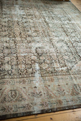 Distressed vintage Mahal rug border with geometric patterns and etched texture.