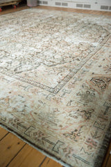 Distressed vintage Mahal rug corner; faded Herati motif in antique ivory, blush, and charcoal.