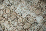 Distressed Vintage Mahal rug detail shows faded Herati motif, aged texture, soft tones.
