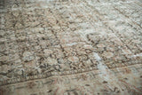Distressed vintage Mahal carpet texture, revealing a softened Herati pattern and pale border.