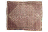 Distressed vintage Malayer rug, central ivory diamond with pale pink motifs, mauve outer field.