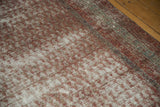 Distressed wine red and ivory pile of an antique Mir Serbend carpet with a slate border.