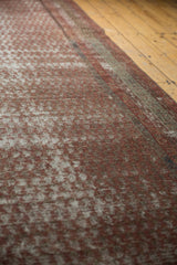 Patina-rich texture of an antique Mir Serbend rug with allover wine red and ivory boteh motifs.