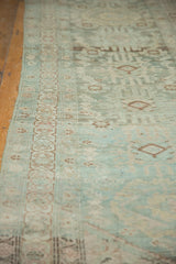 Distressed Hamadan runner with faded teal, antique ivory, and bronze geometric border.