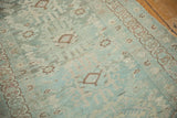 Distressed Hamadan runner showing even wear, faded teal aqua, and bronze finned medallions.