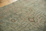 Distressed vintage Hamadan runner with even wear revealing faded teal, bronze, and blush motifs.