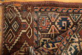 Antique Turkmen geometric hook gul pattern, low pile, visible foundation, in aubergine and navy.