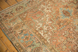 Distressed low pile and geometric motifs in dusty bronze, powder blue, and faded teal.