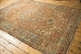 Distressed low pile Heriz carpet, geometric patterns in faded bronze, powder blue, and teal.