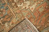 Distressed low pile, geometric pattern, and hand-knotted foundation of Heriz carpet.