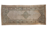Vintage Serab rug runner with a central diamond medallion in muted ivory and dusty slate blue.