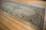 Angled view of a distressed Serab runner's geometric medallion and time-softened colors.