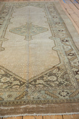Perspective view of a distressed Serab runner showing the low-pile texture and tone-on-tone field.