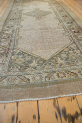 Angled view along a distressed vintage Serab runner highlighting its tone-on-tone geometric field.