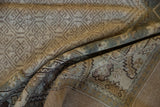 The pliable, low-pile texture of a distressed Persian Serab runner in muted ivory and dusty blue tones.