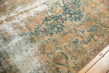 Worn foundation and soft gold, teal floral vinery on a distressed vintage Kashmar carpet.