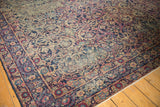 Vintage Persian Yezd carpet corner, navy blue floral borders and cochineal scrolling vines.