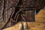 Finely woven vintage Fereghan carpet's black cherry red border and dark navy Herati motif.