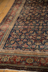 Fine Herati motif on navy field, black cherry red border, mostly even wear on Persian Fereghan.