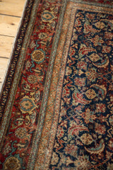 Finely woven vintage Fereghan carpet with navy blue field, red border, and ivory Herati motif.