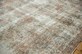 Decorative distressed vintage Kashan carpet detail: exposed foundation, knot heads, and faded floral designs.