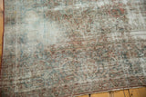 Textured pile and visible foundation on the distressed pale blush Kashan carpet.