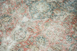 Distressed Kashan carpet texture, exposed foundation, knot heads, and blush red floral motifs.