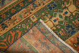 Vintage Laristan rug corner with henna pattern, fringe, and hand-knotted foundation.