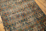 Vintage Laristan rug showing allover henna plant motif in dark blue, brick red, gold with visible foundation wear.