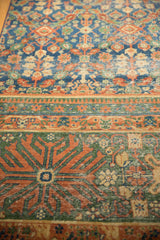 Laristan runner border with terracotta finned contour floral motifs and visible wear.