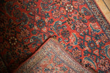 Intricate hand-knotted Persian Bijar runner corner displaying Herati pattern and tight weave back.