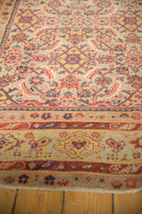 Antique Distressed Malayer runner's Herati motif field and distinct borders with even wear.