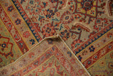 Distressed antique Malayer corner: faded Herati pattern, visible hand-knotted back.