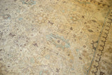 Distressed Tabriz carpet with worn ivory, blue, brown palmettes and scrolling leaves.