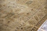 Distressed vintage Tabriz carpet with softened ivory, beige, and blue lotus, palmettes, and pawn border.