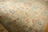Vintage distressed Tabriz detail: sky blue, terra cotta blossomed tendrils, foundation showing.