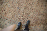 Allover Herati design on a distressed antique Malayer carpet, in faded ivory and pale blue.
