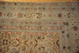 Decorative corner detail of the antique Malayer carpet, worn Herati pattern in pale blue and beige.